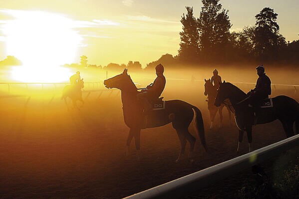 FILE — A fog burns off as the sun rises over the Oklahoma Training Track, in Saratoga Springs, N.Y., Aug. 26, 2005. Venerable Saratoga Race Course adds to its mystique and tradition by hosting the Belmont Stakes for the next two years. The track that predates the end of the U.S. Civil War has never before hosted a Triple Crown race. (AP Photo/Rick Gargiulo, File)