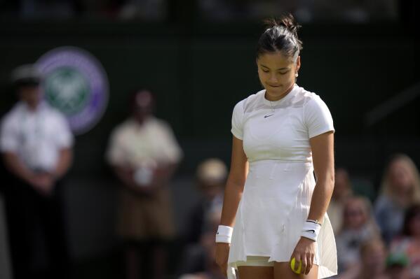 Britain's Emma Raducanu prepares to serve to France's Caroline Garcia during their singles tennis match against on day three of the Wimbledon tennis championships in London, Wednesday, June 29, 2022. (AP Photo/Alastair Grant)