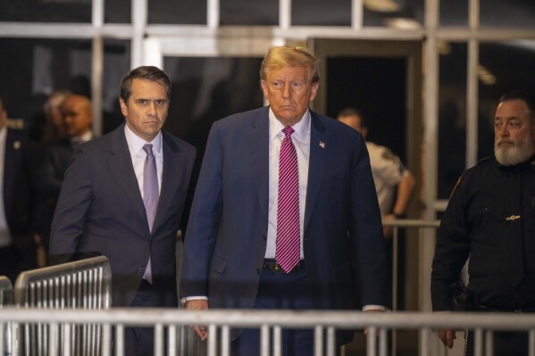 Former President Donald Trump, followed by his attorney Todd Blanche, left, exits the courtroom following proceedings in his trial, Friday, April 19, 2024, at Manhattan Criminal Court in New York. (Mark Peterson/Pool Photo via AP)