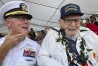 FILE - Ira Schab, right, who survived the attack on Pearl Harbor as a sailor on the USS Dobbin, talks with reporters while sitting next to his son, retired Navy Cmdr. Karl Schab, on Dec. 7, 2022, in Pearl Harbor, Hawaii. Eighty-two years later, Schab plans to return to Pearl Harbor on the anniversary of the attack to remember the more than 2,300 servicemen killed. He's expected to be one of just six survivors at the ceremony commemorating the event that propelled the United States into APWar II. (APPhoto/Audrey McAvoy, File)