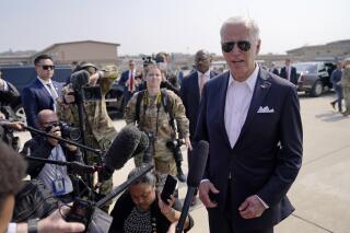 U.S. President Joe Biden speaks before boarding Air Force One for a trip to Japan at Osan Air Base, Sunday, May 22, 2022, in Pyeongtaek, South Korea. (AP Photo/Evan Vucci)