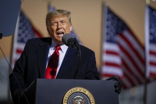 President Donald Trump speaks at a campaign rally Friday, Oct. 30, 2020, in Rochester, Minn. (AP Photo/Bruce Kluckhohn)