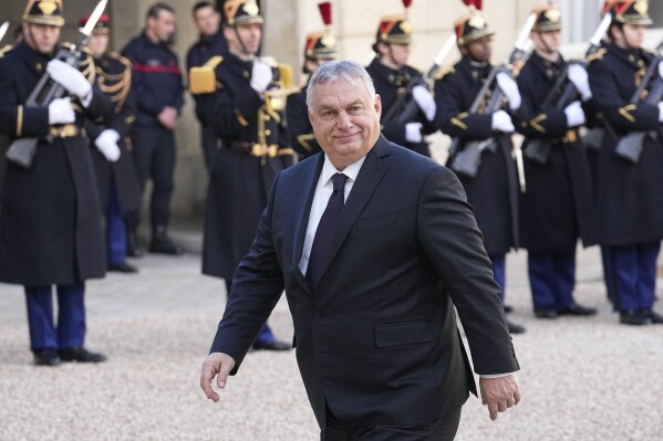 Hungarian Prime Minister Viktor Orban arrives for a lunch at the Elysee Palace after a ceremony for late European Commission president Jacques Delors, Friday, Jan. 5, 2024 in Paris. Jacques Delors, a Paris bank messenger's son who became the visionary and builder of a more unified Europe in his momentous decade as chief executive of the European Union, has died in Paris last week. He was 98. (AP Photo/Michel Euler)