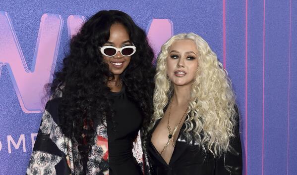 H.E.R., left, and Christina Aguilera arrive at the Billboard Women in Music Awards on Wednesday, March 2, 2022, at the YouTube Theater in Los Angeles. (Photo by Jordan Strauss/Invision/AP)