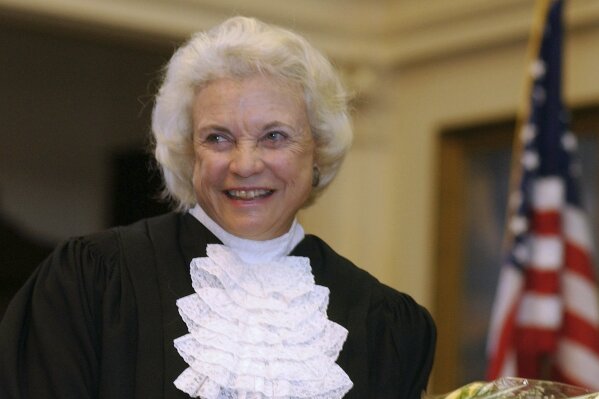 
              FILE - In this Jan. 6, 2003 file photo, U.S. Supreme Court Justice Sandra Day O'Connor is shown before administering the oath of office to members of the Texas Supreme Court in Austin, Texas.  NPR’s “Morning Edition” reports author Evan Thomas found former Chief Justice of the United States William Rehnquist's letter to O’Connor while researching his upcoming book, “First.” The two dated while students at Stanford Law School in the early 1950s. They had broken up, but remained friends. Rehnquist graduated and in a March 29 letter, wrote: "To be specific, Sandy, will you marry me this summer?" She said no. (AP Photo/Harry Cabluck, File )
            