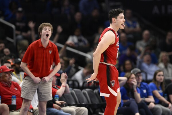 North Carolina State guard Michael O'Connell (12) reacts after hitting a three-pointer against Duke during the second half of an NCAA college basketball game in the quarterfinal round of the Atlantic Coast Conference tournament Thursday, March 14, 2024, in Washington. (AP Photo/Nick Wass)