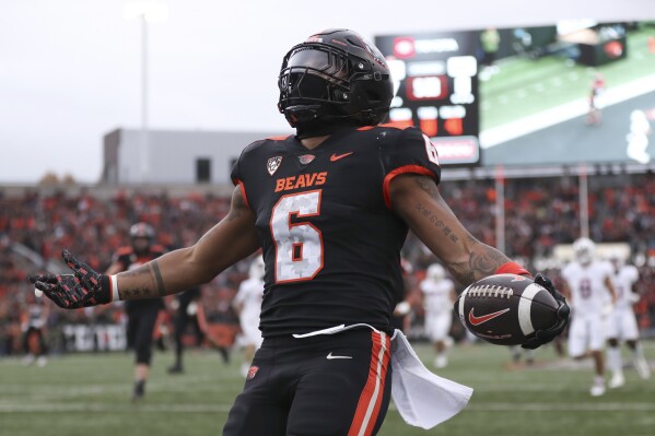 Oregon State running back Damien Martinez (6) celebrates after scoring a touchdown against Stanford during the first half of an NCAA college football game Saturday, Nov. 11, 2023, in Corvallis, Ore. (AP Photo/Amanda Loman)