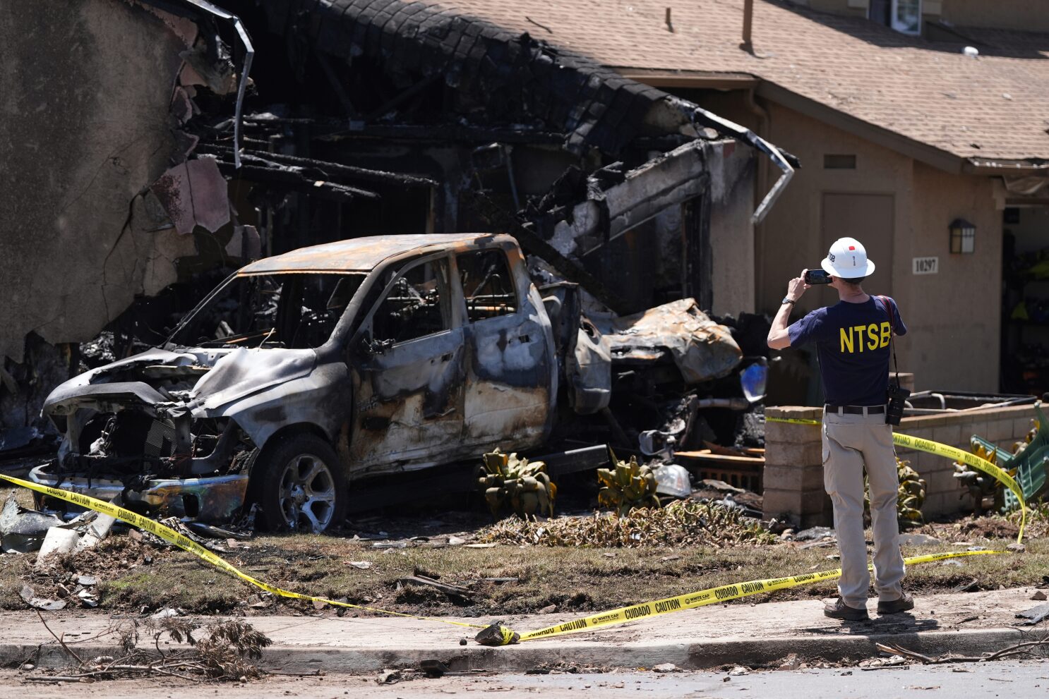 NTSB says plane that crashed into San Diego home was too low and runway lights were inoperable