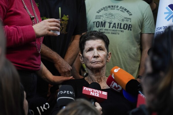 FILE - Yocheved Lifshitz, 85, who was held hostage in Gaza after being abducted during Hamas' bloody Oct. 7 attack on Israel, speaks to members of the press a day after being released by Hamas militants, at Ichilov Hospital in Tel Aviv, Israel, Tuesday, Oct. 24, 2023. (AP Photo/Ariel Schalit, File)