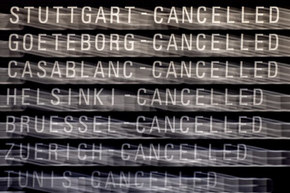 Cancelled flights are displayed on a board in a terminal at the airport in Frankfurt, Germany, Tuesday, Feb. 20, 2024. The trade union Verdi has once again called on Lufthansa ground staff to go on a warning strike. (APPhoto/Michael Probst)