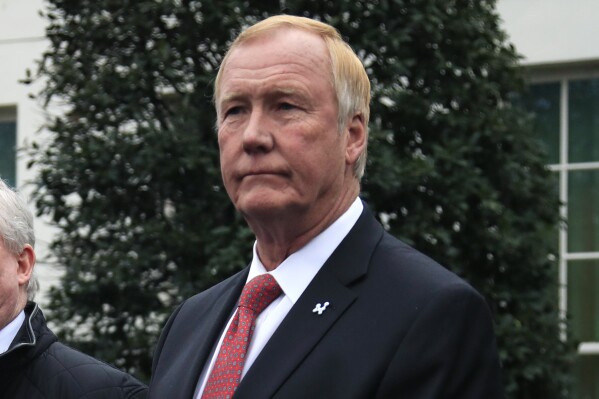 FILE - NuScale Power chairman and CEO John L. Hopkins, listen outside the West Wing of the White House in Washington, following the energy executives' meeting with President Donald Trump on Feb. 12, 2019. A project to build a first-of-a-kind small modular nuclear reactor power plant was terminated Nov. 8, 2023, another blow to the Biden administration's clean energy agenda following cancellations last week of two major offshore wind projects. Oregon-based NuScale Power has the only small modular nuclear reactor design certified for use in the United States. (AP Photo/Manuel Balce Ceneta, File)