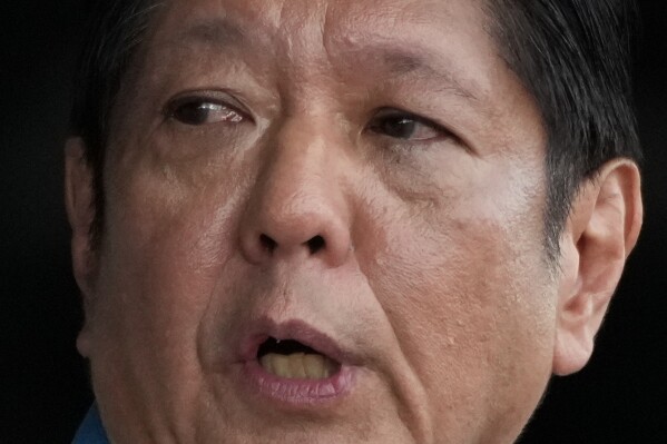 FILE -Philippine President Ferdinand Marcos Jr. speaks during the 89th anniversary of the Armed Forces of the Philippines at the military headquarters Camp Aguinaldo in Quezon City, Philippines on Dec. 20, 2024. (AP Photo/Aaron Favila, File)