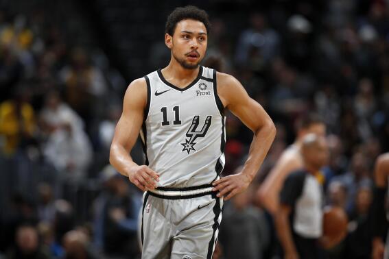 FILE - San Antonio Spurs guard Bryn Forbes (11) watches during the first half of an NBA basketball game on Feb . 10, 2020, in Denver. The former San Antonio Spurs guard and NBA free agent was arrested in San Antonio on a misdemeanor family violence charge, early Wednesday, Feb. 14, 2023. (AP Photo/David Zalubowski, FIle)