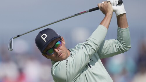 United States' Rickie Fowler plays his tee shot from the 4th on the first day of the British Open Golf Championships at the Royal Liverpool Golf Club in Hoylake, England, Thursday, July 20, 2023. (AP Photo/Kin Cheung)