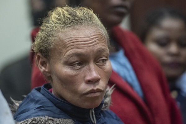 CAPTION CORRECTS DATE The mother of missing 6-year-old Joslin Smith, Kelly Smith, appears in court in Vredenburg, South Africa, Thursday, March 7, 2024. Smith has been charged with kidnapping and selling or trafficking her daughter in a shocking twist in a case that has enraptured the country and sparked deep anger in the small, poor coastal community where the family lives. (AP Photo)