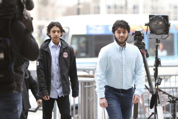 Supporters of the Afzaal family arrive at the London courthouse to attend the sentencing hearing of Nathaniel Veltman in London, Ont., Thursday, Feb. 22, 2024. Veltman, found guilty of using his pickup truck to kill four members of a Muslim family was sentenced to life in prison as a judge ruled that the actions of the “admitted white nationalist” amounted to terrorism. (Nicole Osborne /The Canadian Press via AP)