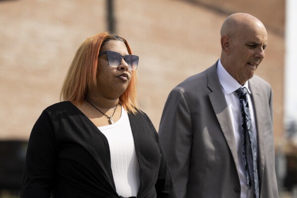 FILE - Deja Taylor arrives to the United States Courthouse in Newport News, Va., on Thursday, Sept. 21, 2023, with her lawyer James Ellenson. Taylor, the mother of a 6-year-old who shot his teacher in Virginia is scheduled to be sentenced Wednesday, Nov. 15, for using marijuana while owning a gun, which is illegal under U.S. law. (Billy Schuerman/The Virginian-Pilot via AP, File)