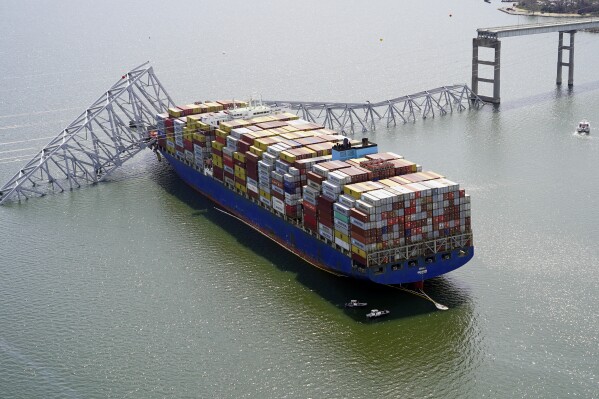 FILE - In this photo provided by the Maryland National Guard, the cargo ship Dali is stuck under part of the structure of the Francis Scott Key Bridge after the ship hit the bridge, Tuesday, March 26, 2024, in Baltimore. (Maryland National Guard via AP, File)