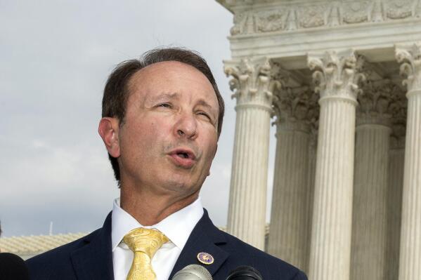 FILE - In this Sept. 9, 2019, file photo, Louisiana Attorney General Jeff Landry speaks in front of the U.S. Supreme Court in Washington. Landry and a Republican state lawmaker filed a lawsuit Wednesday, Dec. 15, 2021, seeking to block Gov. John Bel Edwards' plans to add the COVID-19 vaccine to Louisiana’s immunization schedule for schools and colleges.  (AP Photo/Manuel Balce Ceneta, File)