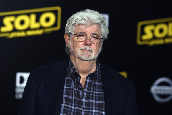 FILE - George Lucas arrives at the premiere of 