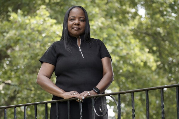 Philadelphia school district teacher Rhonda Hicks poses for a portrait at her home in Philadelphia, Thursday, July 20, 2023. Hicks loved teaching and loved her students, but other aspects of the job deteriorated. When she retires soon, she will join a disproportionately high number of Black and Hispanic teachers in her state who are leaving the profession. (AP Photo/Michael Perez)