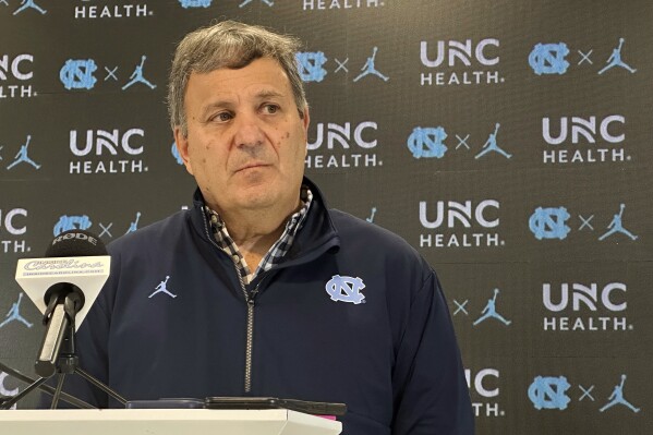 North Carolina general manager Michael Lombardi speaks with reporters during an NCAA college football news conference, Tuesday, Feb. 11, 2025, in Chapel Hill, N.C., about two months after the hiring of football coach Bill Belichick, (AP Photo/Aaron Beard)
