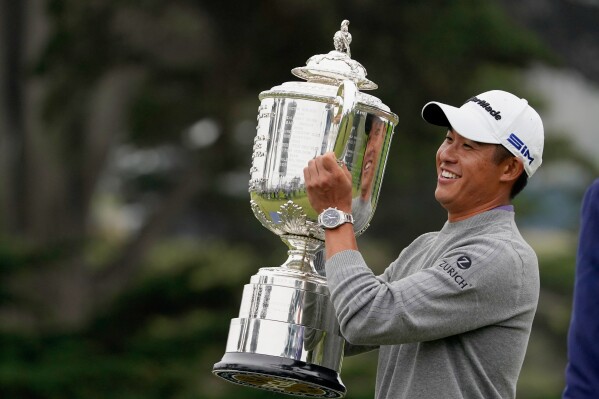Collin Morikawa holds the Wanamaker Trophy after winning the PGA Championship golf tournament at TPC Harding Park Sunday, Aug. 9, 2020, in San Francisco. (AP Photo/Charlie Riedel, File)