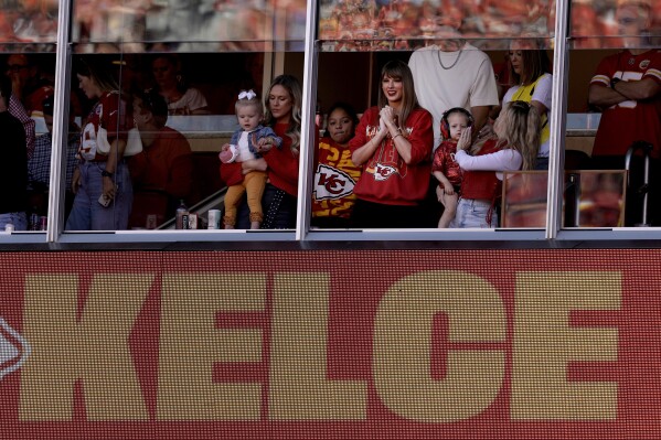 Taylor Swift watches from a suite during the first half of an NFL football Sunday, Oct. 22, 2023, in Kansas City, Mo. (AP Photo/Charlie Riedel)