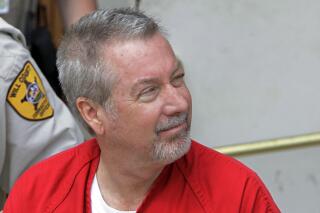 FILE - In this May 8, 2009, file photo, former Bolingbrook, Ill., police Sgt. Drew Peterson leaves the Will County Courthouse in Joliet, Ill., after his arraignment on charges of first-degree murder in the 2004 death of his third wife Kathleen Savio. On Monday, Feb. 7, 2022, Peterson's legal team is scheduled to ask a judge to vacate his 2012 conviction in the murder of Savio. (AP Photo/M. Spencer Green, File)