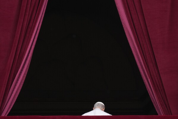 Pope Leo XIV leaves after delivering his message from the central balcony of St. Peter's Basilica for his first Sunday blessing after his election, in St. Peter's Square at the Vatican, Sunday, May 11, 2025.(AP Photo/Gregorio Borgia)