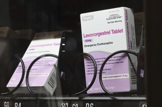 FILE - The emergency contraceptive levonorgestrel is displayed for sale in a vending machine on the campus of the University of Washington in Seattle on Friday, June 2, 2023. Taking piroxicam, which is typically prescribed for arthritis, together with the morning-after pill levonorgestrel could boost its effectiveness when taken up to three days after unprotected sex, according to new research published Wednesday, Aug. 16, 2023. (Kevin Clark/The Seattle Times via AP, File)