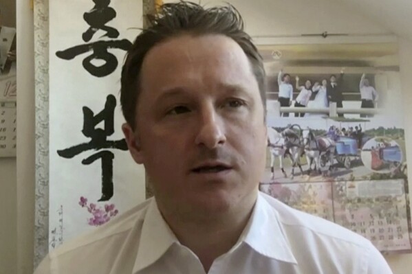 FILE - In this file image made from a March 2, 2017, video, Michael Spavor, director of Paektu Cultural Exchange, talks during a Skype interview in Yanji, China. The Canadian government has reached a settlement with Spavor, who, along with fellow Canadian Michael Kovrig, was detained in China for nearly three years on national security charges. A lawyer for Spavor, confirmed Wednesday, March 6, 20204, a settlement had been concluded. (AP Photo/File)