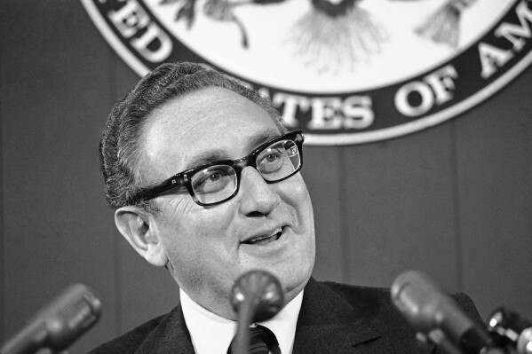 FILE - Secretary of State Henry Kissinger briefs reporters, Oct. 12, 1973, at the State Department in Washington. Kissinger, the diplomat with the thick glasses and gravelly voice who dominated foreign policy as the United States extricated itself from Vietnam and broke down barriers with China, died Wednesday, Nov. 29, 2023. He was 100. (AP Photo, File)