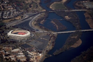 RFK Stadium is visible from Air Force One as it takes off from Andrews Air Force Base, Md., Nov. 29, 2017. (AP Photo/Andrew Harnik, File)