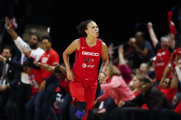 FILE - In this Thursday, Oct. 10, 2019, file photo, then-Washington Mystics guard Kristi Toliver celebrates after her 3-point basket during the first half of Game 5 of basketball's WNBA Finals against the Connecticut Sun, in Washington. The Los Angeles Sparks will be without Chiney Ogwumike and Toliver for the WNBA season so they can focus on their health the team announced Friday, June 26, 2020. (AP Photo/Alex Brandon, File)