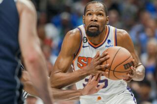 Phoenix Suns forward Kevin Durant (35) drives to the basket during the second half of an NBA basketball game against the Dallas Mavericks, Sunday, March 5, 2023, in Dallas. (AP Photo/Gareth Patterson)