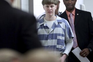FILE - In this Monday, April 10, 2017 file photo, Dylann Roof arrives to a courtroom at the Charleston County Judicial Center in Charleston, S.C., to enter his guilty plea on murder charges. The white supremacist church shooter staged a hunger strike in February 2020 while on federal death row, alleging in letters to The Associated Press that he’s been “targeted by staff,” “verbally harassed and abused without cause” and “treated disproportionately harsh.” (Grace Beahm/The Post And Courier via AP, Pool, File)