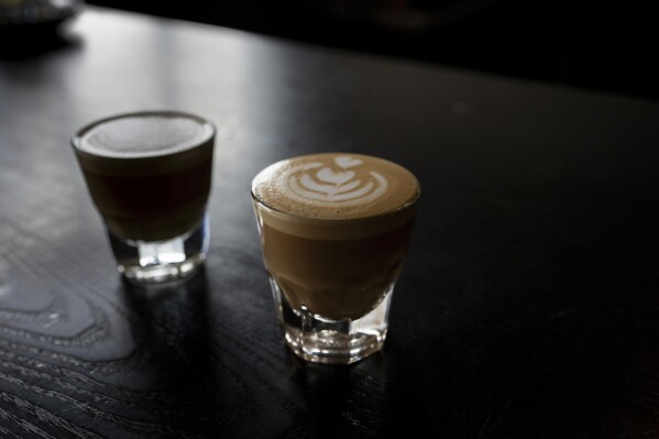 A couple of espresso drinks sit on a counter at Fuego Coffee Roasters, Saturday, March 22, 2025, in Rochester, N.Y. (Max Conway via AP)