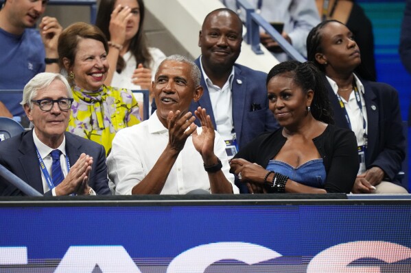 Former President Barack Obama and his wife Michelle attend the first round of the U.S. Open tennis championships, Monday, Aug. 28, 2023, in New York. (AP Photo/Frank Franklin II)