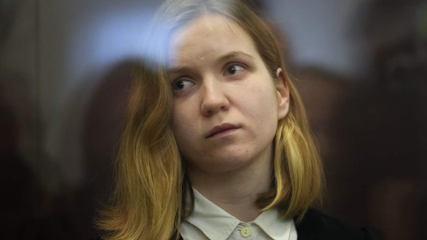 Russian woman goes on trial in a cafe bombing that killed a prominent military blogger