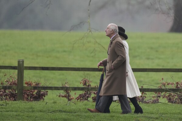 Britain's King Charles III and Queen Camilla leave after attending a Sunday church service at St Mary Magdalene Church, in Sandringham, Norfolk, England, Sunday, Feb. 11, 2024. (PA via AP)