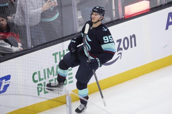 Seattle Kraken left wing Andre Burakovsky celebrates his game overtime goal against the New Jersey Devils in an NHL hockey game, Thursday, Jan. 19, 2023, in Seattle. (AP Photo/John Froschauer)