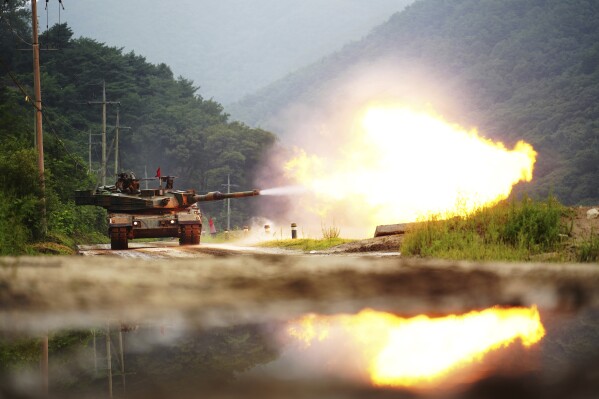 In this photo provided by South Korea Defense Ministry, a South Korean army's K1A2 tank fires during a drill as part of South Korea and the United States' joint annual military exercise, the Ulchi Freedom Shield, at a training filed in Cheorwon, South Korea, Wednesday, Aug. 30, 2023. (South Korea Defense Ministry via AP).
