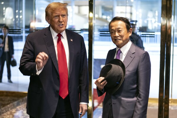 Republican presidential candidate former President Donald Trump meets with former Japanese Prime Minister Taro Aso at Trump Tower in midtown Manhattan in New York, Tuesday, April 23, 2024. (AP Photo/Craig Ruttle)