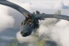 This image released by Universal Pictures shows Mason Thames, as Hiccup, riding Night Fury dragon, Toothless in a scene from "How to Train Your Dragon.", (Universal Pictures via AP)
