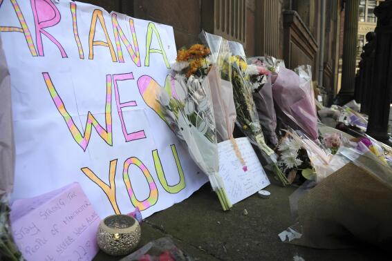 FILE - Flower tributes at St Ann's square, Manchester, England, on May 23, 2017, after a suicide bombing attack at an Ariana Grande concert at the Manchester Arena. Britain's domestic intelligence agency didn't act swiftly enough on key information and missed a significant opportunity to prevent the suicide bombing that killed 22 people at a 2017 Ariana Grande concert, an inquiry found Thursday, March 2, 2023. (AP Photo/Rui Vieira, File)
