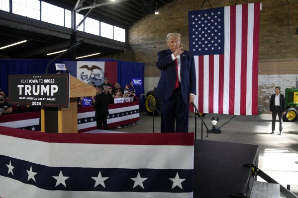 Former President Donald Trump arrives at a commit to caucus rally, Saturday, Oct. 7, 2023, in Waterloo, Iowa. (AP Photo/Charlie Neibergall)