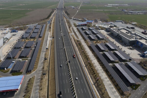 Solar panels power a rest station and provide power for electric vehicles along a highway on the outskirts of Jinan in eastern China's Shandong province on March 21, 2024. (AP Photo/Ng Han Guan)