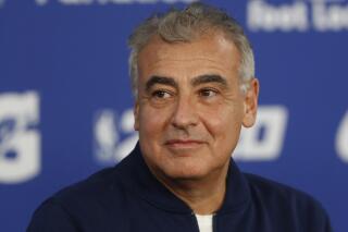 FILE - In this Jan. 24, 2020, file photo, Marc Lasry, co-owner of the NBA's Milwaukee Bucks attends a press conference ahead of NBA basketball game between Charlotte Hornets and Milwaukee Bucks in Paris. Lasry, the hedge-fund billionaire and Milwaukee Bucks co-owner who was named chairman of embattled media organization Ozy earlier this month, has resigned from its board.  (AP Photo/Thibault Camus, File)