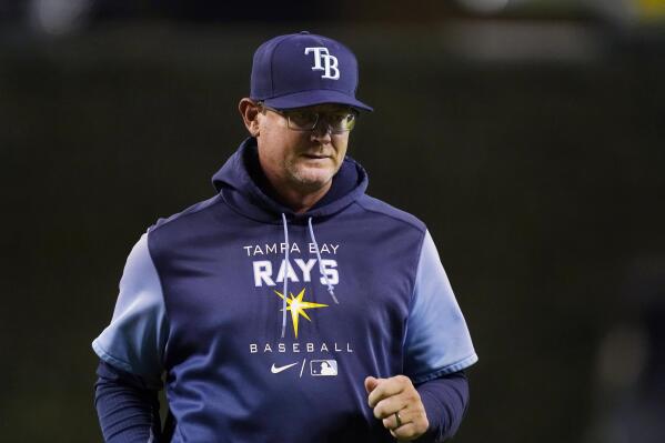 Tampa Bay Rays pitching coach Kyle Snyder walks back to the dugout after a mound visit during the ninth inning of the team's baseball game against the Detroit Tigers, Thursday, Aug. 4, 2022, in Detroit. Snyder injured himself walking toward the mound to visit Shane McClanahan during the seventh inning of the team's 9-1 loss to the Tigers on Saturday. The 44-year-old Snyder had to return to the dugout, and manager Kevin Cash went out to speak with McClanahan instead. (AP Photo/Carlos Osorio)